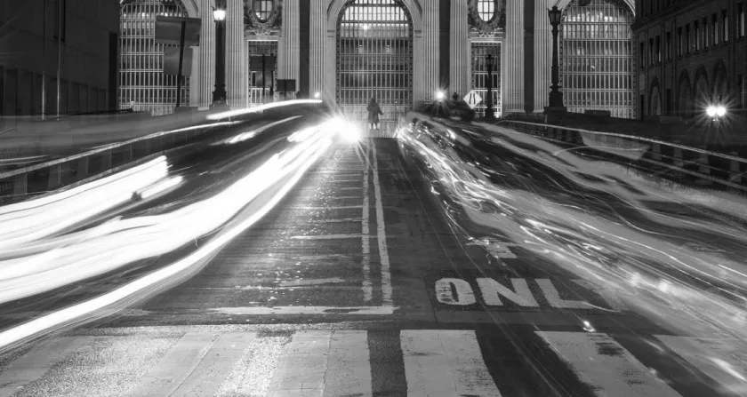 Black and White image of a street with cars