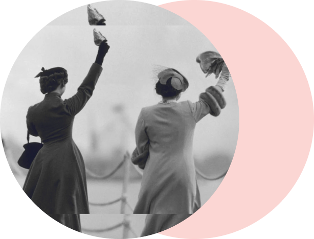 Two women in vintage clothing waving farewell as they embark on a new business initiative.