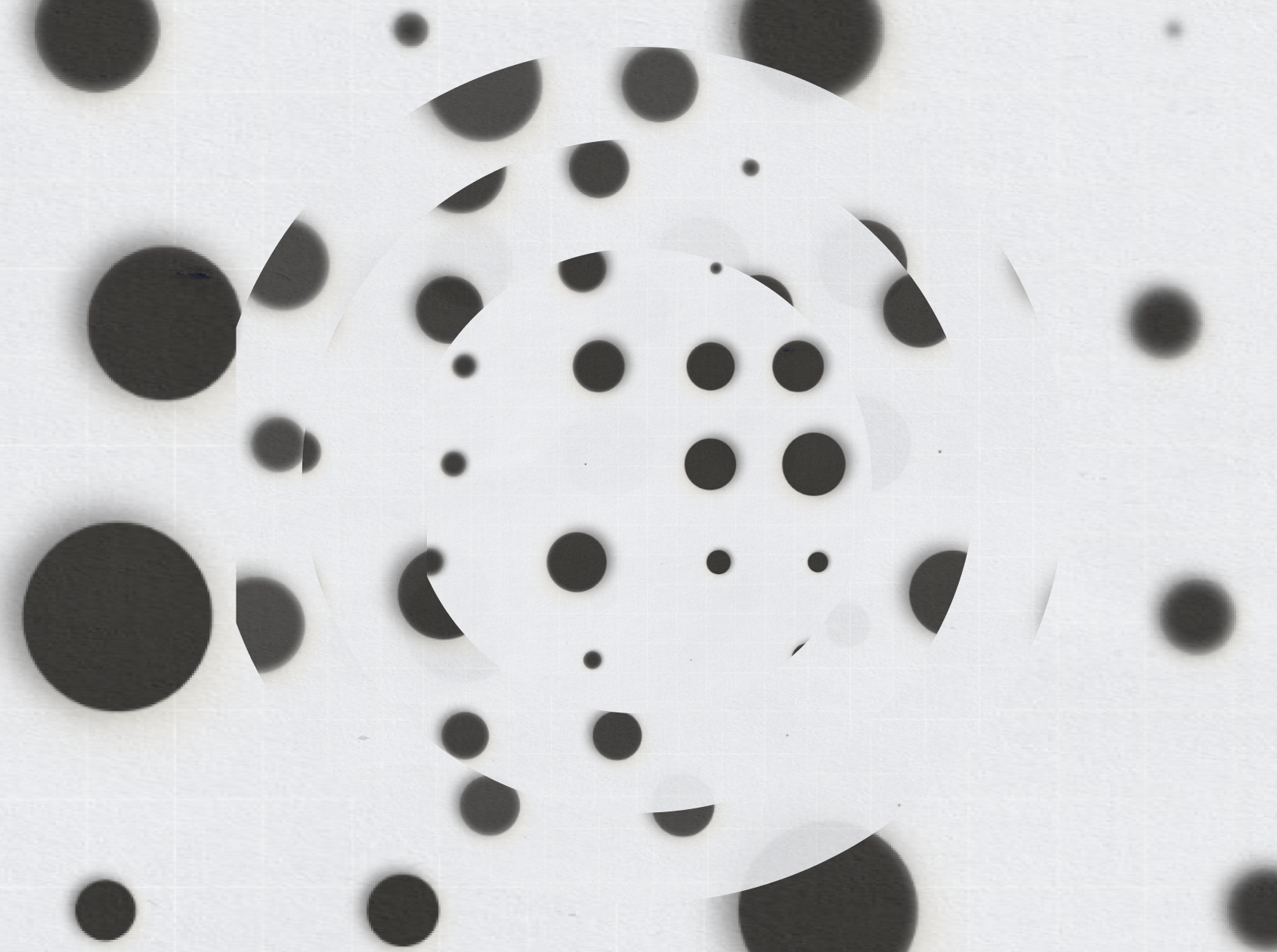 Abstract monochrome dot pattern with radial blur effect.