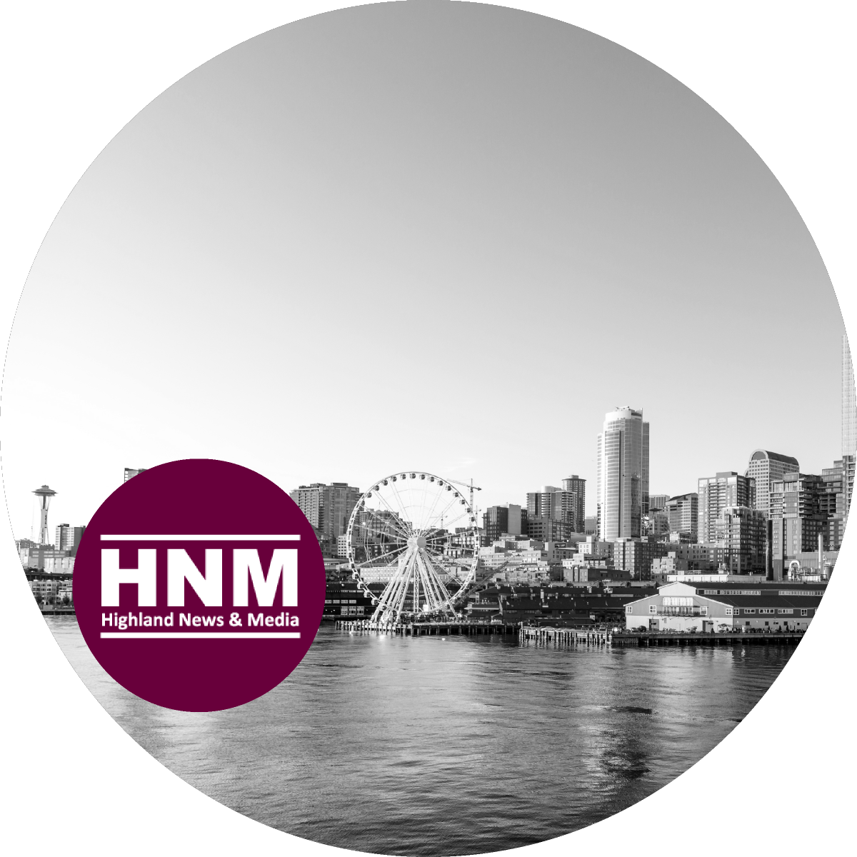 Black and white image of a city skyline with a waterfront, Ferris wheel, and tall buildings. The HNM (Highland News & Media) logo is in the bottom left corner.