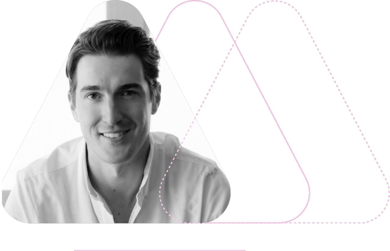 Black and white photo of a person smiling, framed in a triangular shape with dotted triangle outlines in the background.