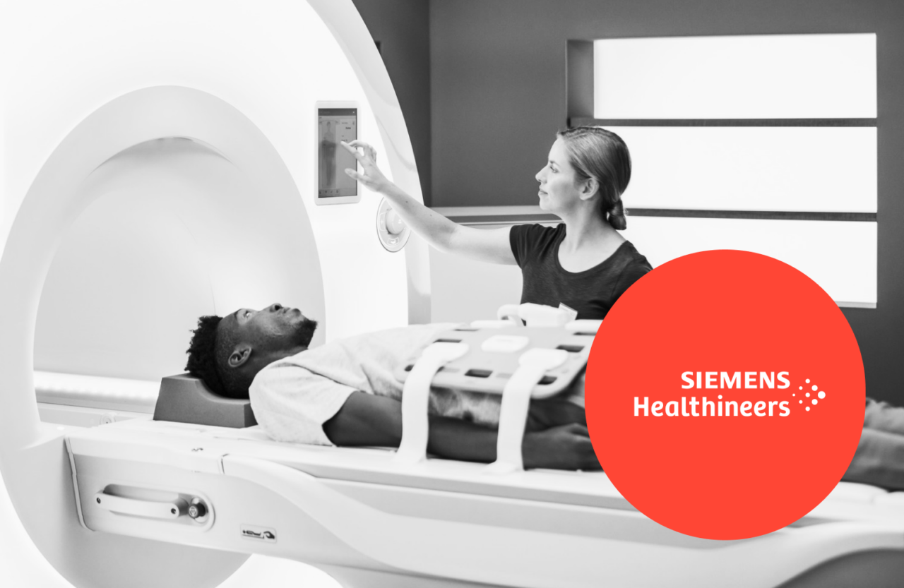 A medical professional operates an MRI machine while a patient lies inside it; Siemens Healthineers logo is displayed in the corner.