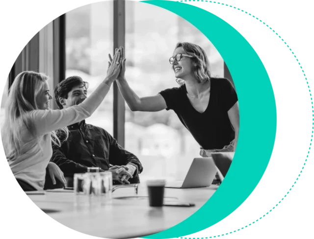 black and white image of teammates giving high fives.