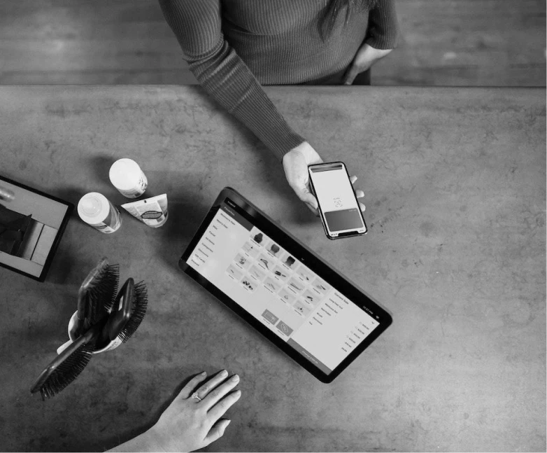 image of a person paying with their phone